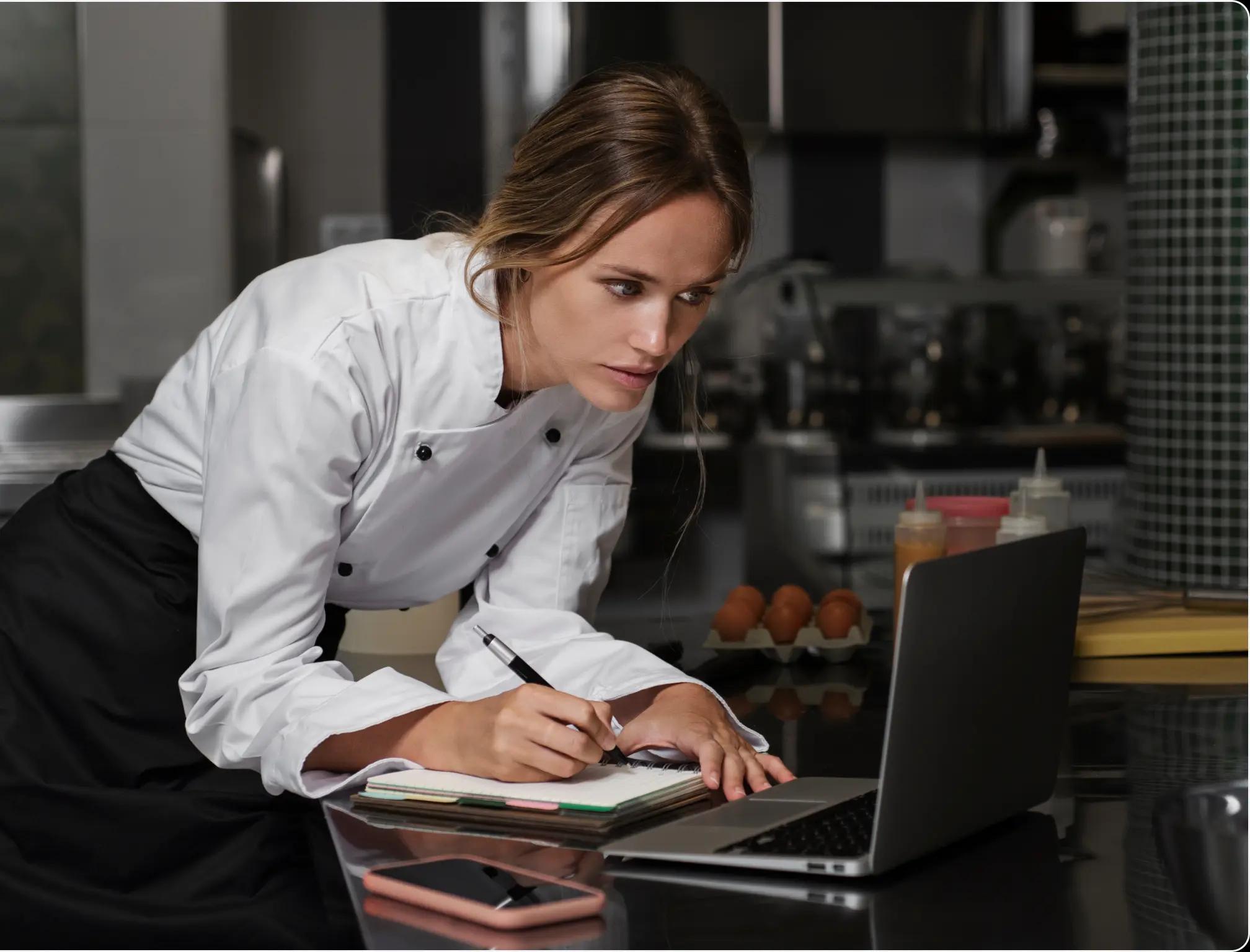 a waiter using a computer