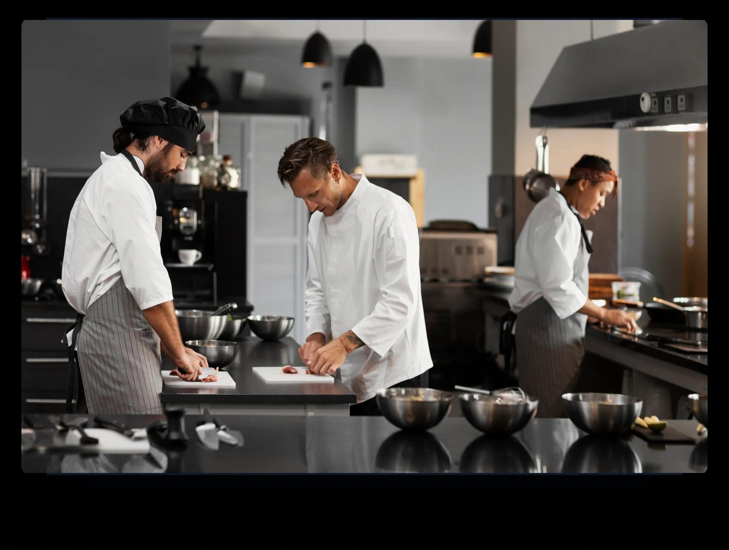 chef and helpers in a kitchen